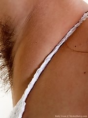 Baby Lizza strips naked and plays naked on bed